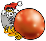 Clip Art Graphic of a Flash Camera Cartoon Character Wearing a Santa Hat, Standing With a Christmas Bauble