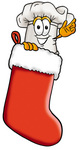 Clip Art Graphic of a White Chefs Hat Cartoon Character Inside a Red Christmas Stocking