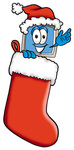 Clip Art Graphic of a Desktop Computer Cartoon Character Wearing a Santa Hat Inside a Red Christmas Stocking