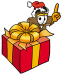 Clip Art Graphic of a Wooden Cross Cartoon Character Standing by a Christmas Present