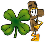 Clip Art Graphic of a Wooden Cross Cartoon Character With a Green Four Leaf Clover on St Paddy’s or St Patricks Day