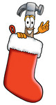 Clip Art Graphic of a Hammer Tool Cartoon Character Inside a Red Christmas Stocking