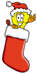 Clip Art Graphic of a Yellow Electric Lightbulb Cartoon Character Wearing a Santa Hat Inside a Red Christmas Stocking