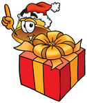 Clip Art Graphic of a Yellow Safety Hardhat Cartoon Character Standing by a Christmas Present