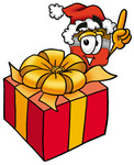 Clip Art Graphic of a Red Paintbrush With Yellow Paint Cartoon Character Standing by a Christmas Present