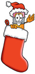 Clip Art Graphic of a Yellow Number 2 Pencil With an Eraser Cartoon Character Wearing a Santa Hat Inside a Red Christmas Stocking