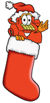 Clip Art Graphic of a Red Landline Telephone Cartoon Character Wearing a Santa Hat Inside a Red Christmas Stocking