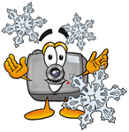 Clip Art Graphic of a Flash Camera Cartoon Character Surrounded by Snowflakes in Winter