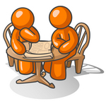 Clip Art Graphic of an Orange Guy Character And Friend Sitting At A Table And Looking At Papers